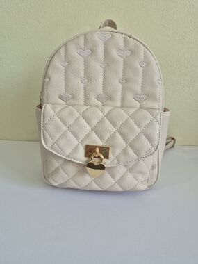 Under One Sky Cream Quilted Backpack with Gold Heart Lock